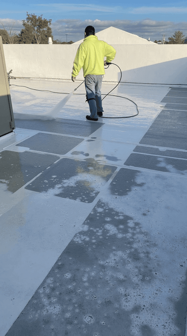 JRH crew applying commercial roof coating